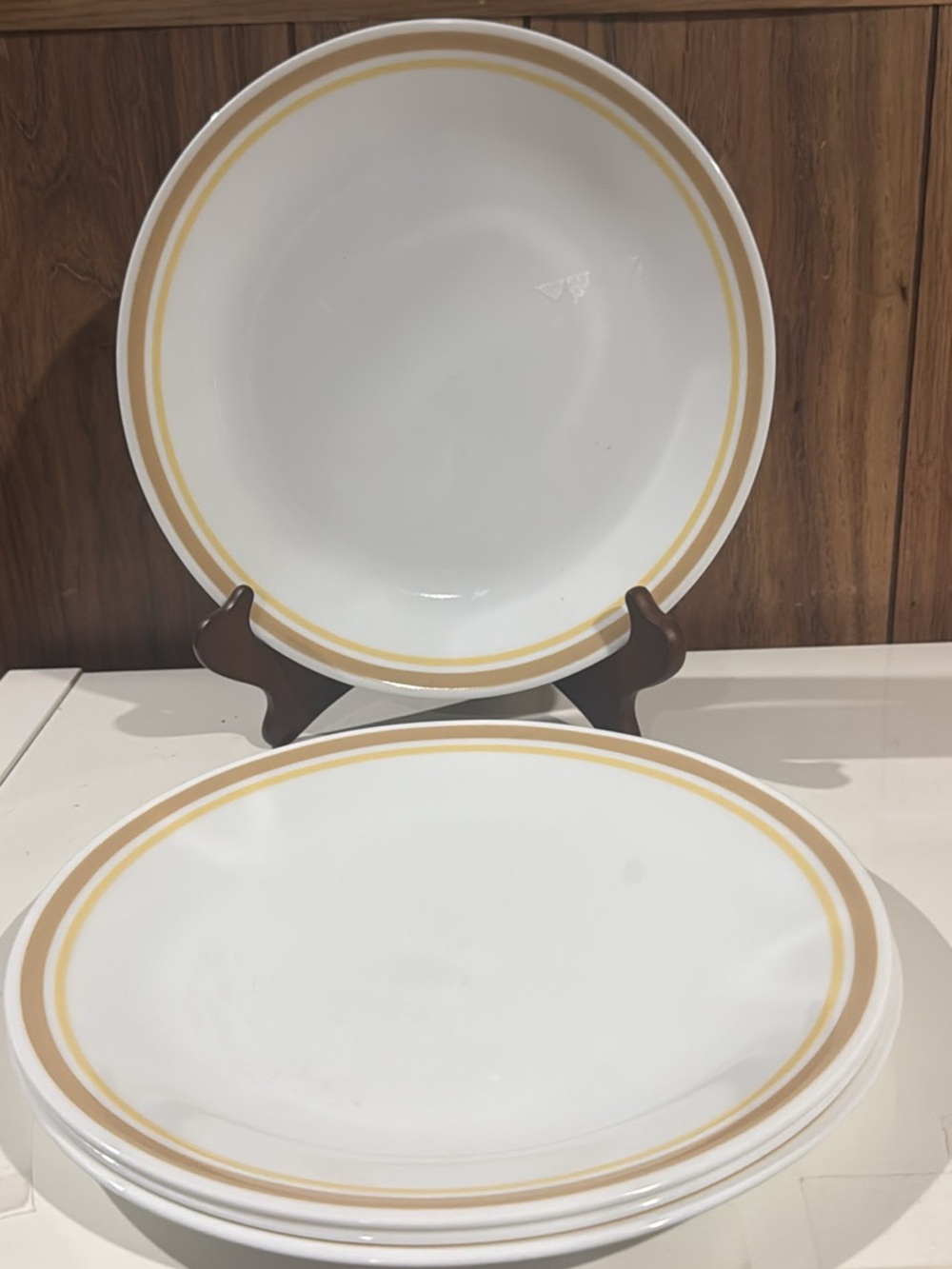 Set of Four (4) Corelle Almond Dinner Plates Rimmed Yellow Tan Bands Rings